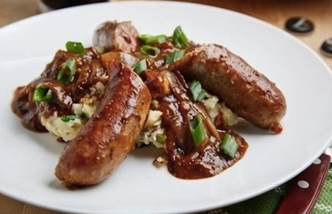 Bangers And Colcannon With Guinness Onion Gravy