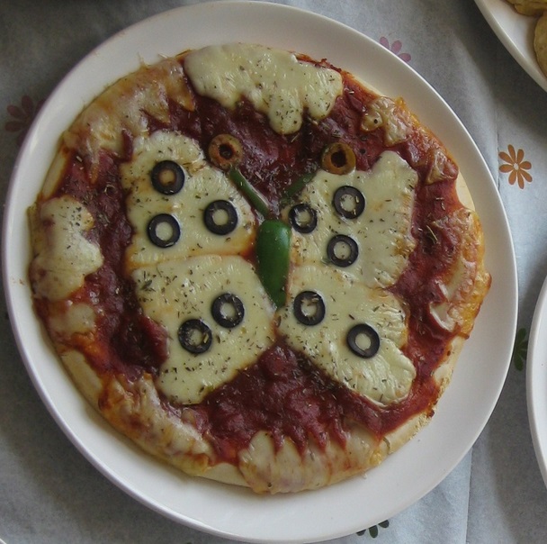 Cheese And Tomato Pizza That Looks Like a Butterfly