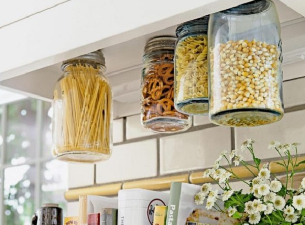 Mason Jars Screwed Under Kitchen Cabinet